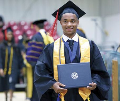 Alfred Love, who also graduated from KCHS last week, receives his associate’s degree during graduation.